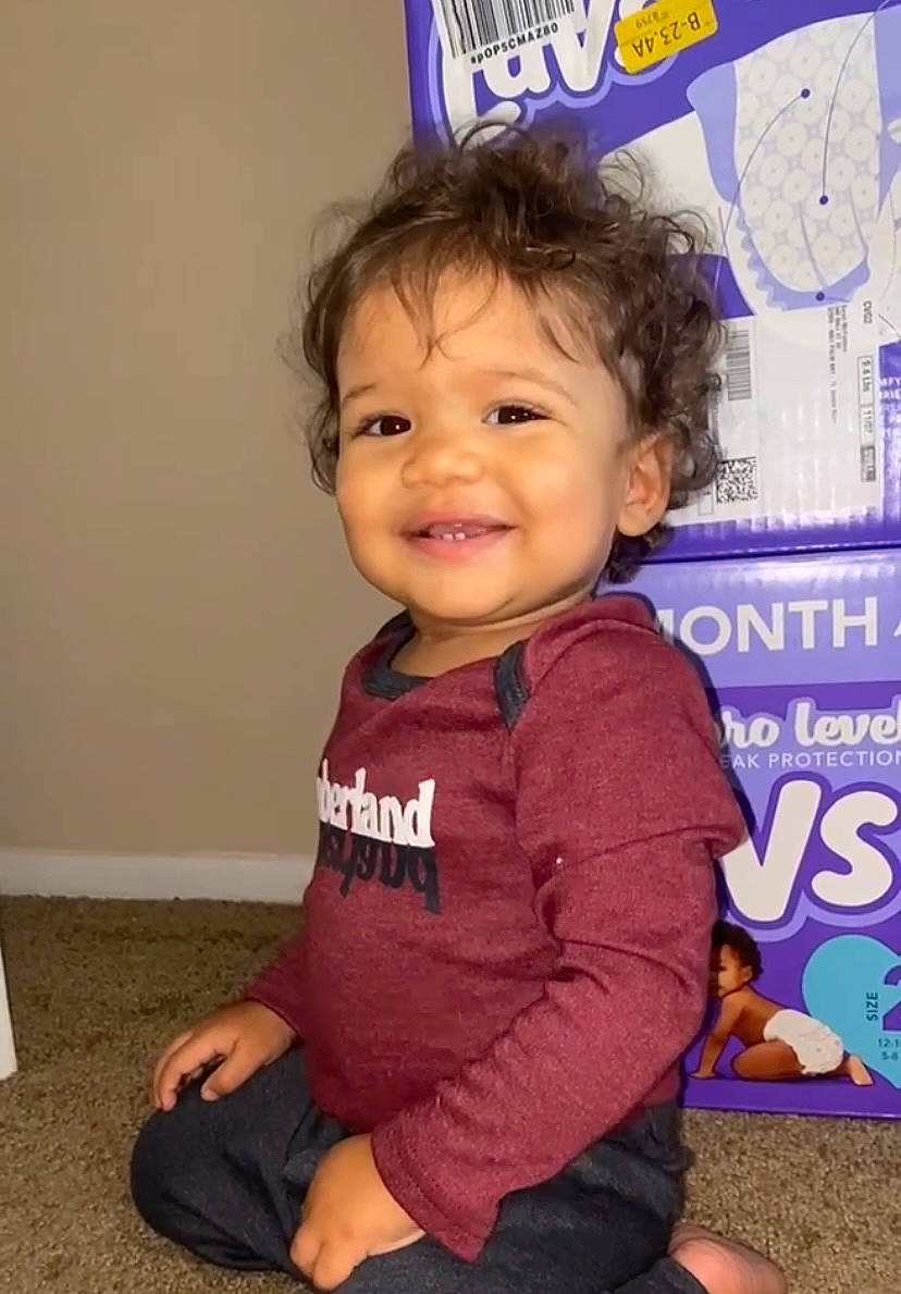 Krüe joined the competition — help win amazing prizes! baby, baby_toddler_clothing, cheek, child, electric_blue, flooring, fun, happy, joy, logo, magenta, person, play, room, sitting, skin, sleeve, smile, sock, t_shirt