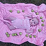 baby, infant, pink_blanket, grass, green_apples, circle, onesie, sweet_and_sassy, outdoor, cute, face, lying_down, blue_eyes, small_fruit, nature, texture, skin, child, portrait, peaceful