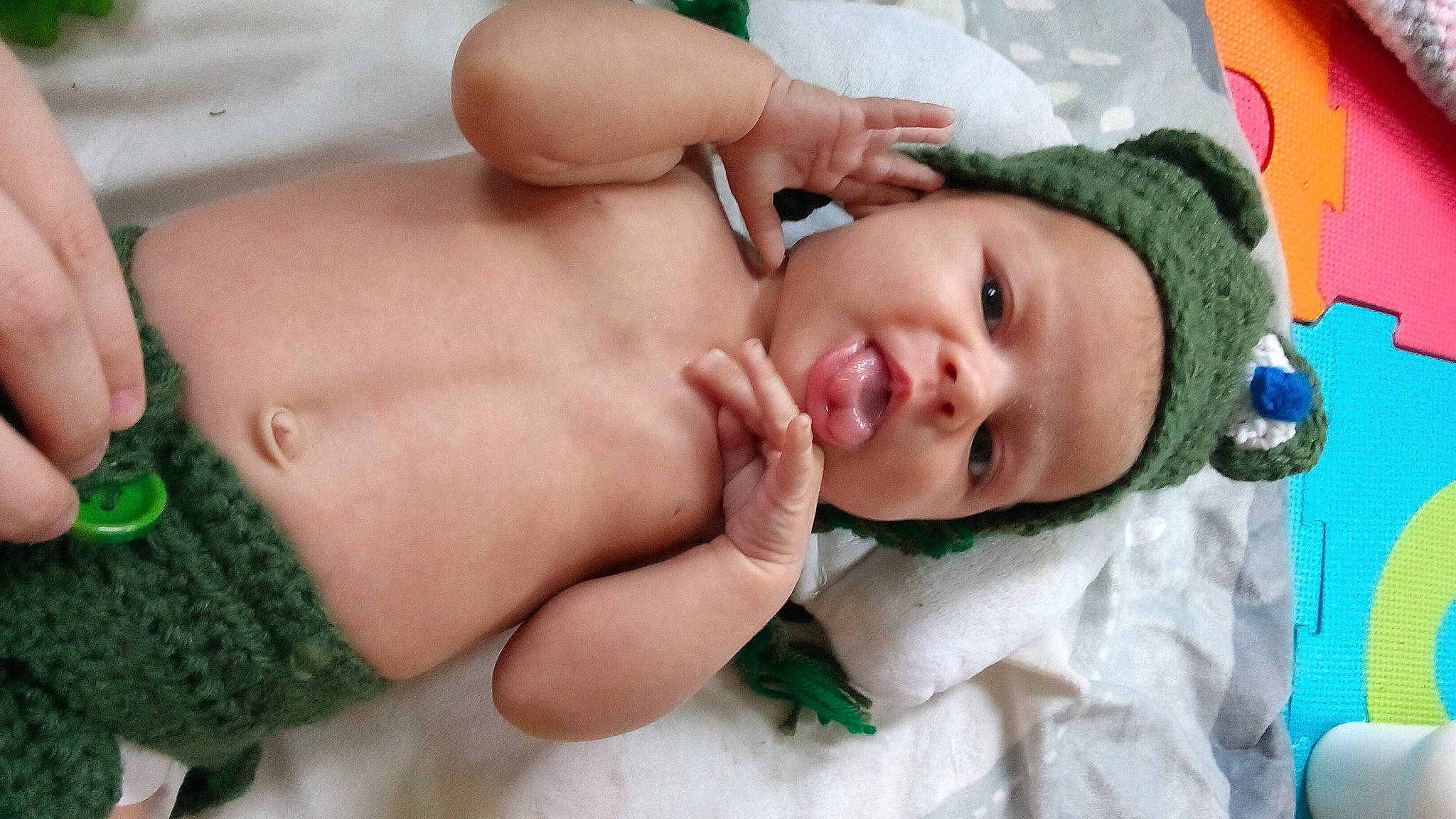 Maryjayne is registered to the contest to win money with this photo: abdomen, baby, baby_products, cheek, chest, comfort, eye, eyelash, finger, gesture, grass, green, happy, navel, pattern, person, skin, textile, thumb, toddler