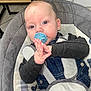 Leeroy participe au concours pour gagner de l'argent avec cette photo : baby, child, clothing, comfort, cushion, cute, denim, expression, face, gray, hands, human, indoor, infant, looking, pacifier, person, resting, seat, young
