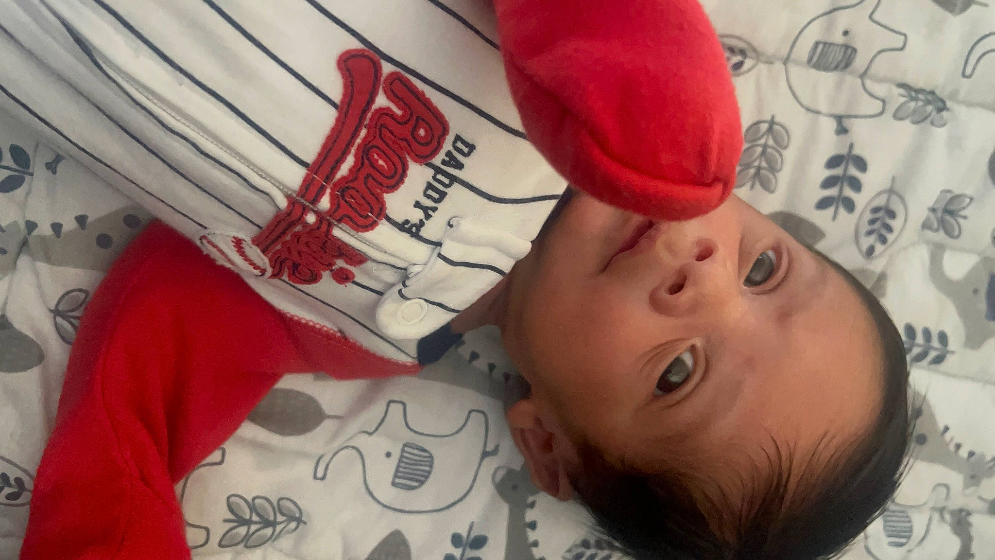 Beckham is registered to the contest to win money with this photo: baby, baby_products, baby_toddler_clothing, cap, carmine, cheek, child, comfort, eyelash, fashion_accessory, fun, happy, headgear, linens, lip, mouth, nose, pattern, person, room