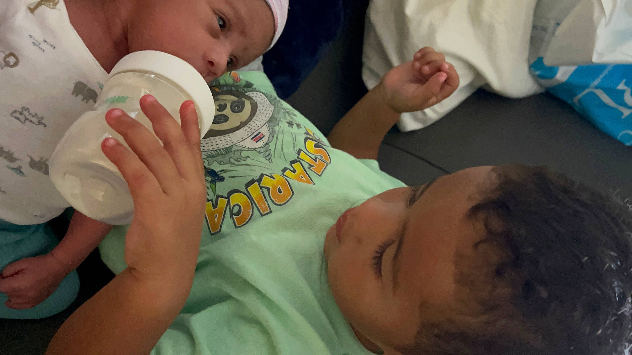 Eli joined the competition — help win amazing prizes! arm, baby, baby_toddler_clothing, cheek, child, drinkware, ear, eyelash, face, facial_expression, finger, gesture, hand, happy, headwear, mouth, nose, person, plastic_bottle, product