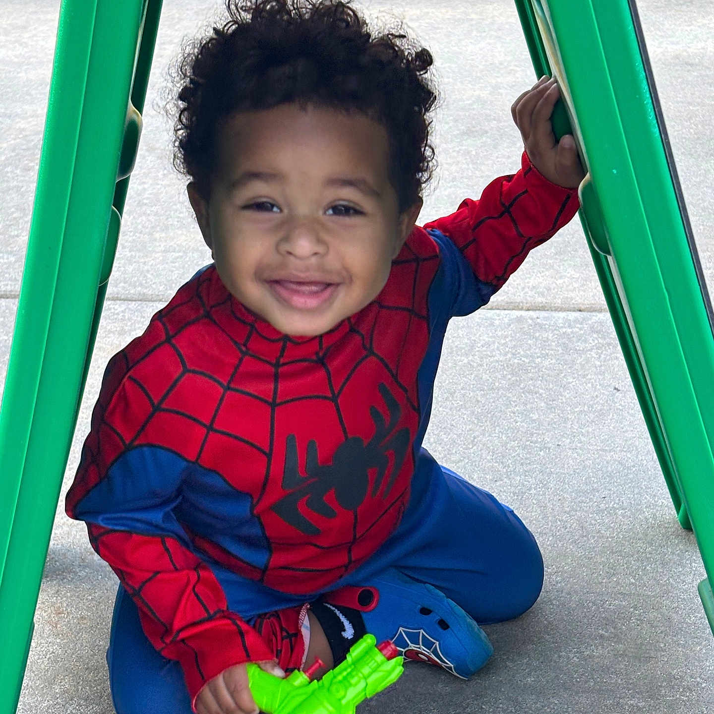 Kaiden is registered to the contest to win money with this photo: bodypart, boy, child, clothing, face, finger, grass, hand, happy, head, male, outdoorplayarea, outdoors, pants, person, photography, plant, playarea, portrait, toy