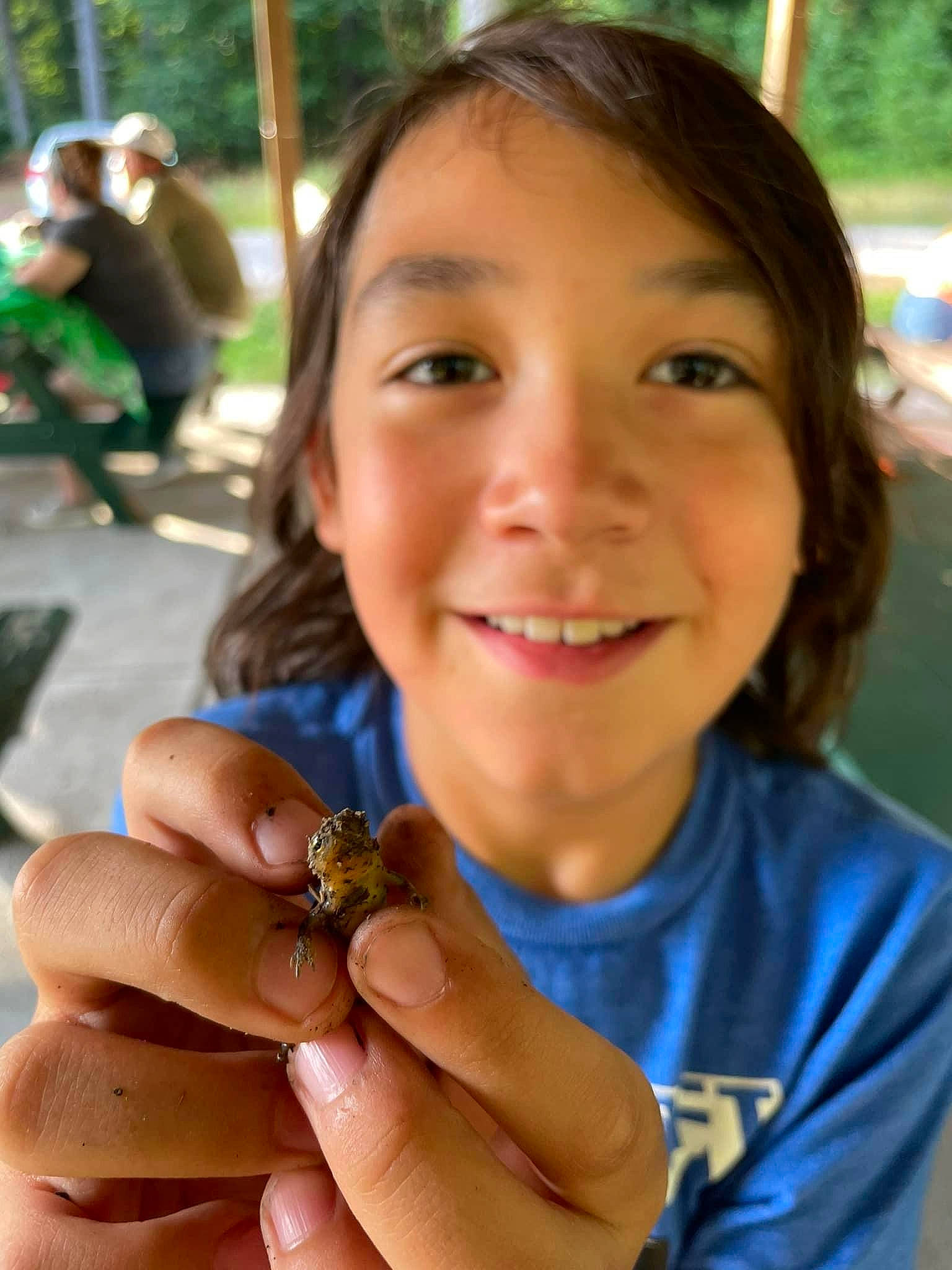 Ian is registered to the contest to win money with this photo: arthropod, child, finger, fun, gesture, grass, happy, insect, joy, leisure, moths_and_butterflies, nail, people, person, plant, pollinator, skin, smile, summer, thumb