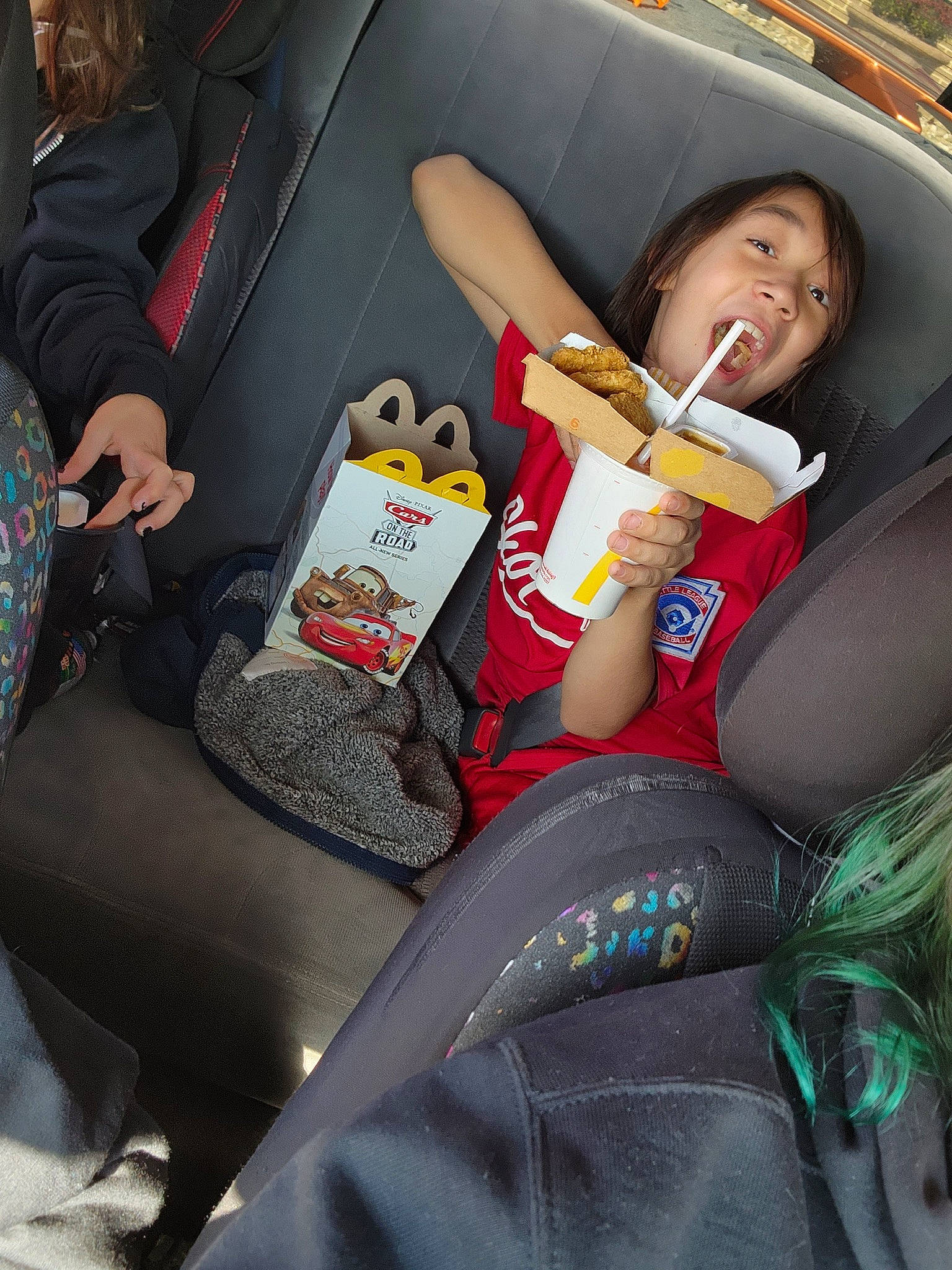 Ian is registered to the contest to win money with this photo: auto_part, automotive_design, car_seat, comfort, family_car, fun, happy, head_restraint, human_leg, knee, lap, leisure, motor_vehicle, nail, passenger, person, sitting, smile, thigh, thumb