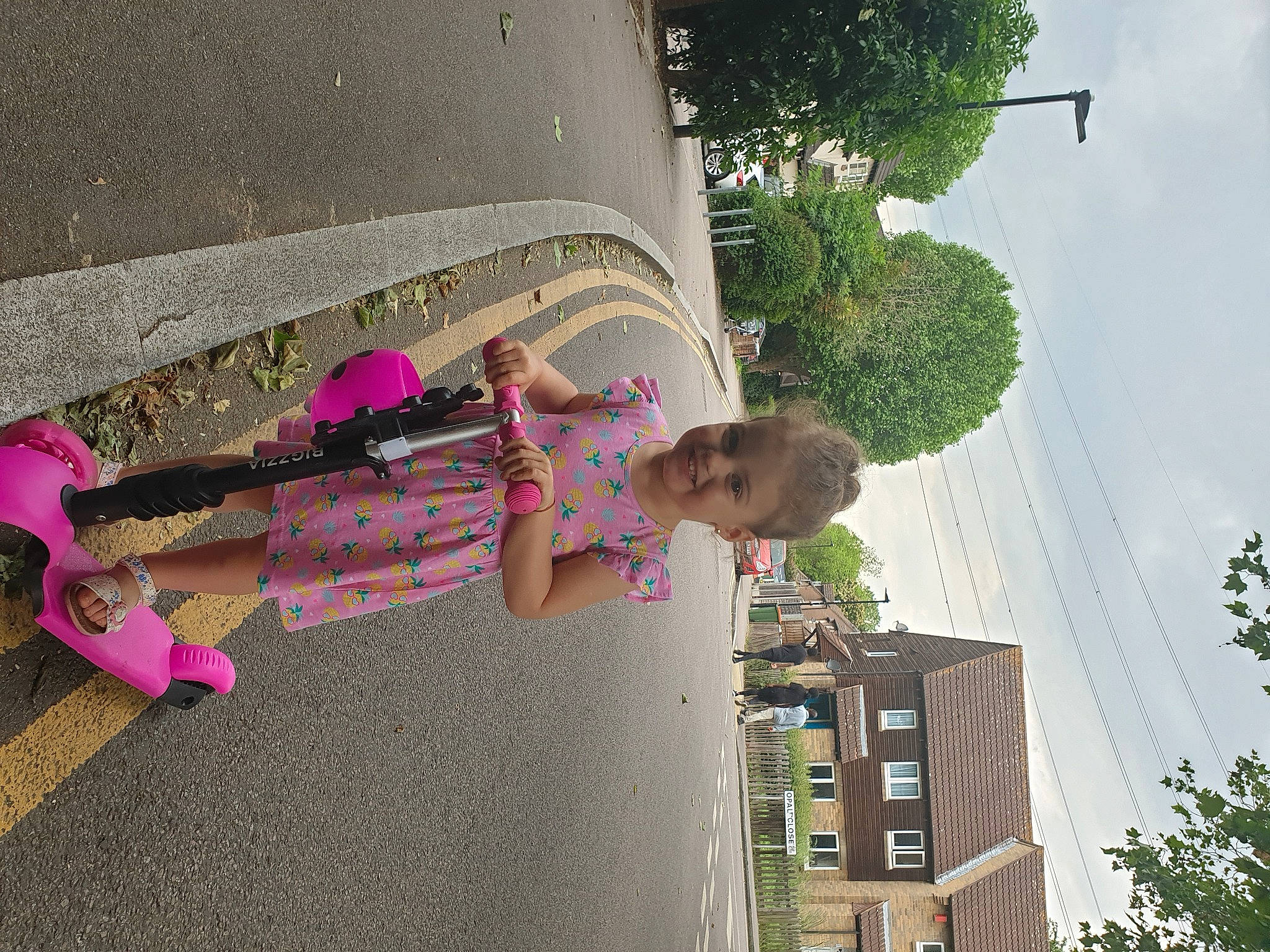 Alexia is registered to the contest to win money with this photo: building, child, city, facade, fun, house, human_settlement, joy, leisure, magenta, mixed_use, person, plant, sky, summer, t_shirt, tints_and_shades, toddler, tree, urban_design