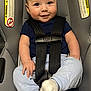Colton is registered to the contest to win money with this photo: baby, car_seat, child, infant, smile, blue_clothing, white_socks, seatbelt, safety, cute, indoor, person, face, head, young_child, happy, seat, clothing, skin, hair