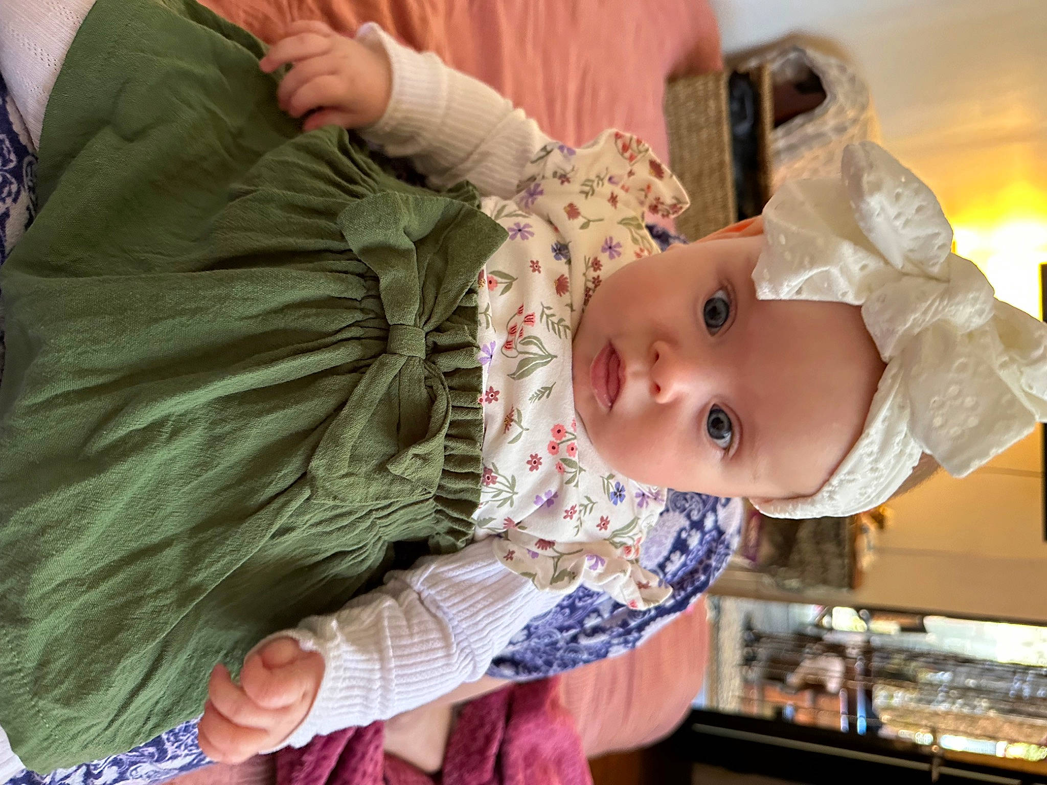 Isla-rose is registered to the contest to win money with this photo: baby, baby_products, baby_toddler_clothing, cheek, child, comfort, eyelash, fashion_accessory, happy, headwear, pattern, person, room, sitting, skin, sleeve, textile, toddler