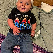 Oaklie is registered to the contest to win money with this photo: baby, casual, child, clothing, cozy, cute, dolly_parton, happy, headband, home, indoor, infant, jeans, person, pillow, portrait, quilt, seated, smile, tshirt
