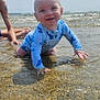 Zayne joined the competition — help win amazing prizes! baby, child, water, beach, ocean, swimsuit, blue, smiling, crawling, sunny, waves, tattoo, adult, sky, shallow_water, sand, happy, outdoor, summer, vacation