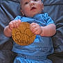 Zayne joined the competition — help win amazing prizes! baby, infant, child, blue_clothing, milestone_marker, wooden_toy, blanket, lying_down, cute, portrait, young_child, shorts, tshirt, indoor, expression, hands, face, eyes, skin, person