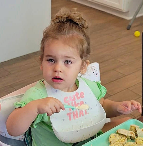 Fiona joined the competition — help win amazing prizes! baby, baby_toddler_clothing, baking, chair, child, comfort_food, cooking, cuisine, dish, finger, finger_food, food, food_craving, happy, junk_food, person, recipe, sitting, t_shirt, table