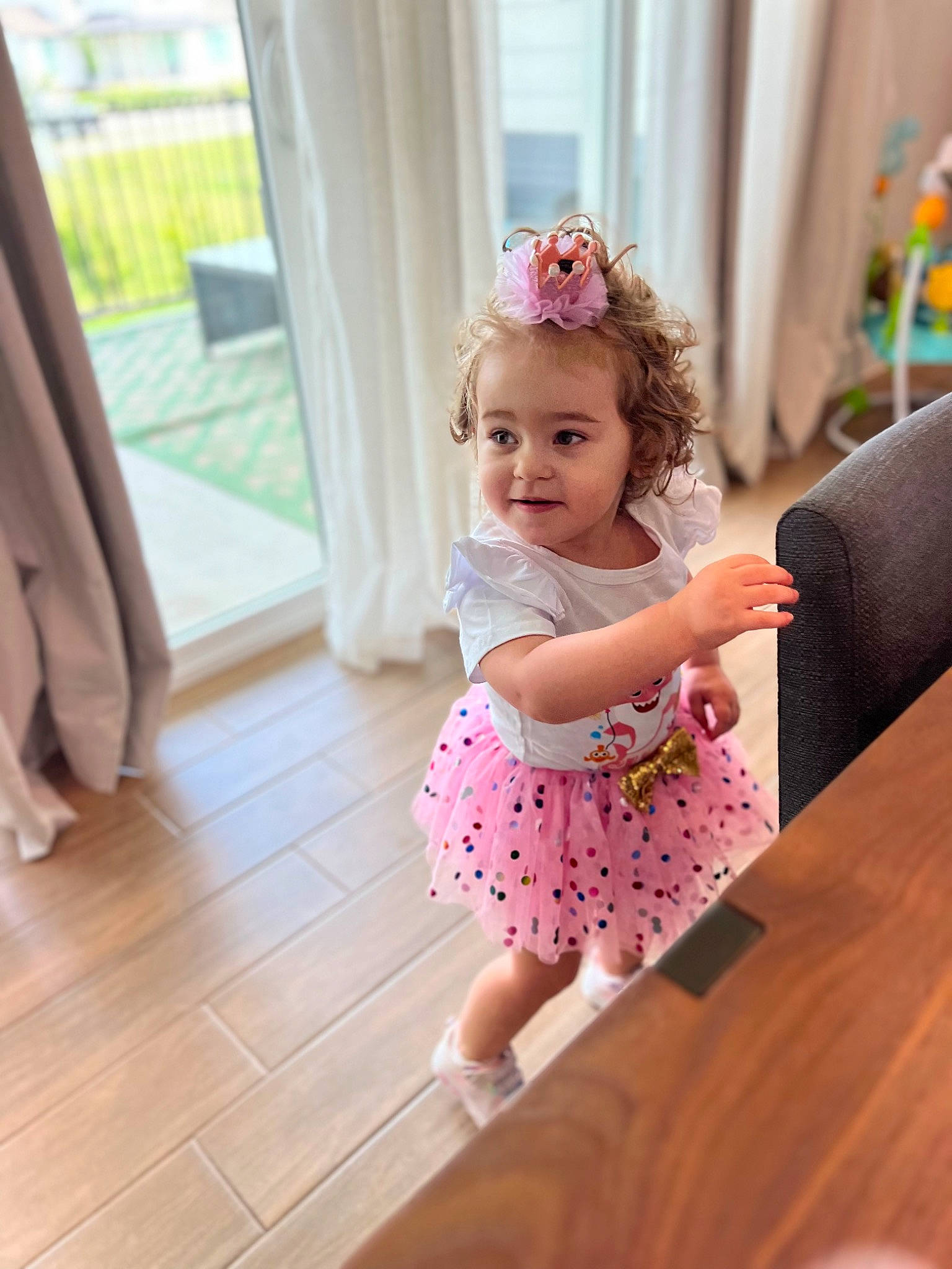 Fiona joined the competition — help win amazing prizes! arm, baby_toddler_clothing, dress, facial_expression, flooring, fun, happy, hardwood, joint, joy, magenta, person, pink, product, purple, shoulder, skin, sleeve, smile, textile