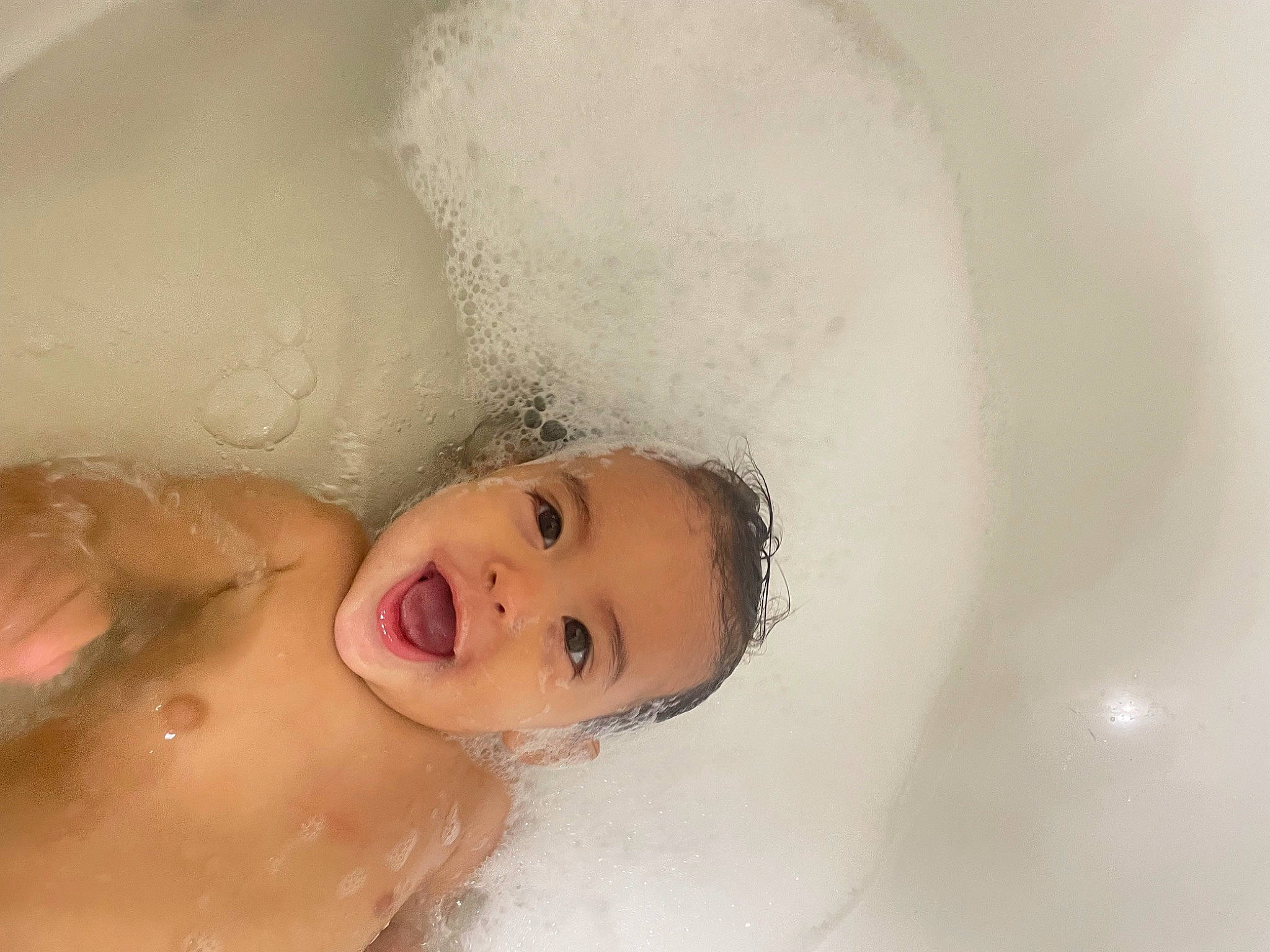 Scarlett Rose is registered to the contest to win money with this photo: arm, bathing, bathroom, bathtub, cheek, chest, eye, eyebrow, eyelash, face, fluid, foam, hair, happy, head, jaw, lip, nose, person, smile