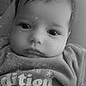 baby, infant, face, portrait, black_and_white, sparkle_effect, screenshot, mobile_phone, app_icons, clothing, text, expressionless, close_up, child, indoors, screen, technology, person, head, young