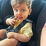 toddler, child, car_seat, blue_eyes, curly_hair, yellow_shirt, safety_harness, car_interior, seatbelt, cute, baby, person, infant, portrait, sitting, young_child, hands, face, expression, vehicle