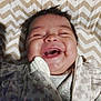 Abigail joined the competition — help win amazing prizes! baby, infant, smiling, happy, face, chevron_pattern, blanket, clothing, cute, closeup, young_child, joy, portrait, indoor, sleepwear, person, expression, child, baby_girl, candid