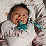 Abigail joined the competition — help win amazing prizes! baby, smiling, pacifier, bib, love, star_pattern, cushion, pajamas, minnie_mouse, clothing, infant, face, happy, cute, child, indoor, portrait, person, baby_girl, sleepwear