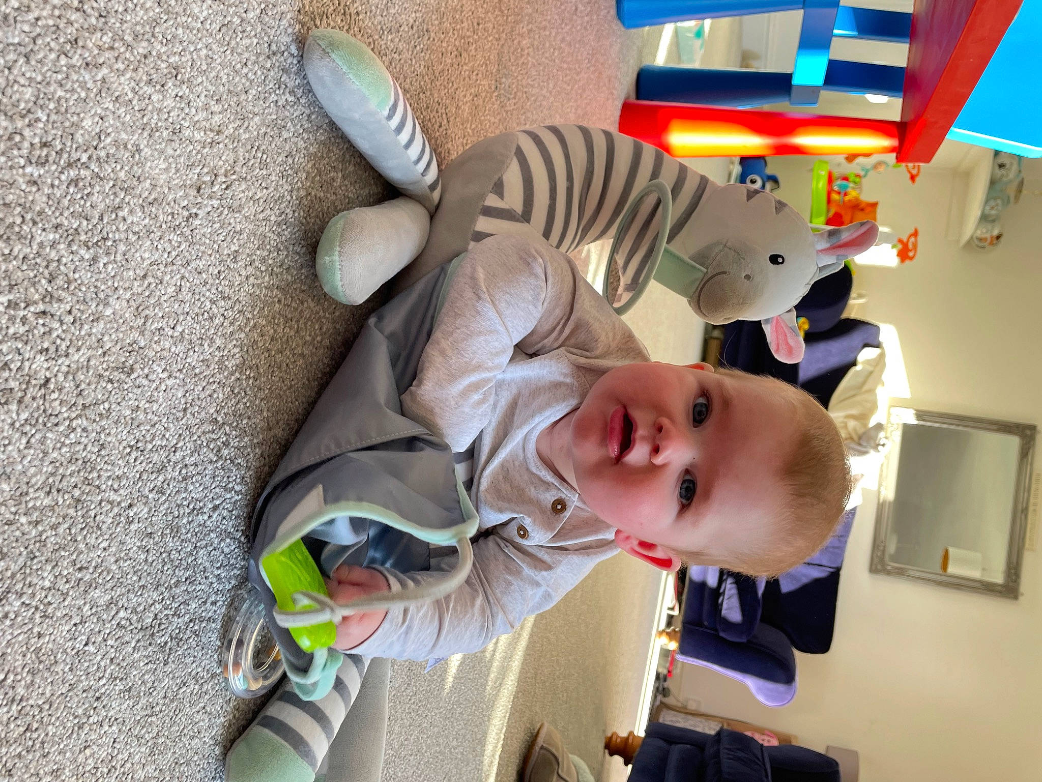 Louis is registered to the contest to win money with this photo: baby, baby_products, baby_safety, baby_toddler_clothing, baby_toys, child, comfort, fun, happy, person, play, room, smile, stuffed_toy, suit, toddler, toy