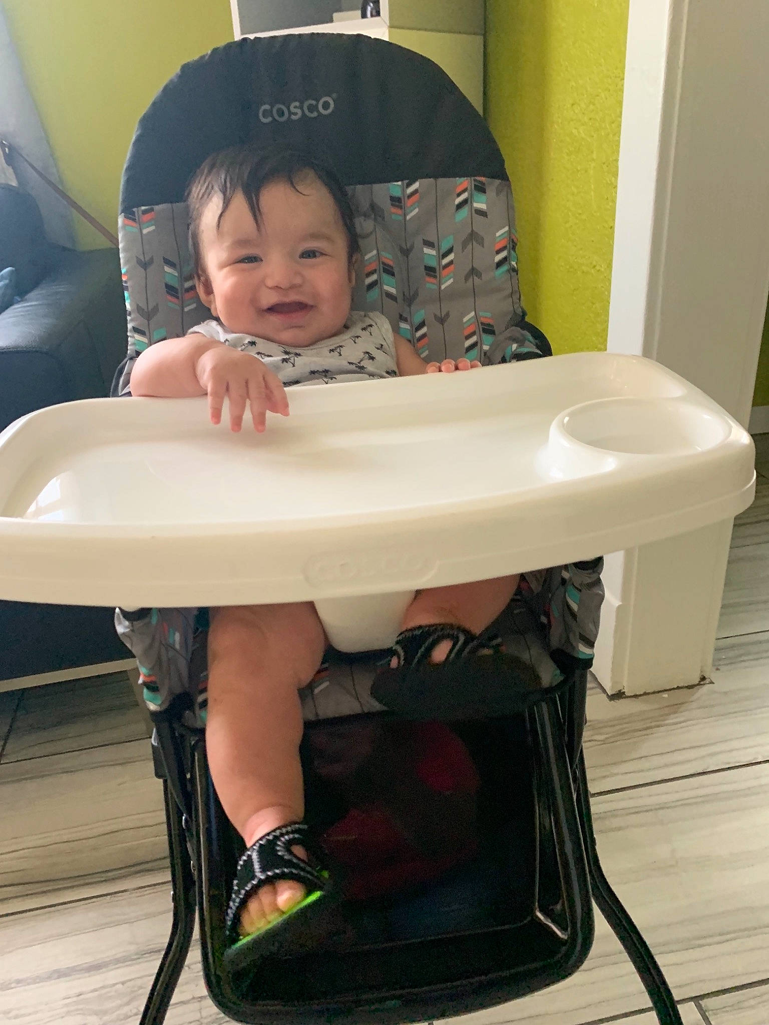 Ernie is registered to the contest to win money with this photo: baby, baby_carriage, baby_products, chair, child, comfort, furniture, leg, person, product, sitting, table, toddler