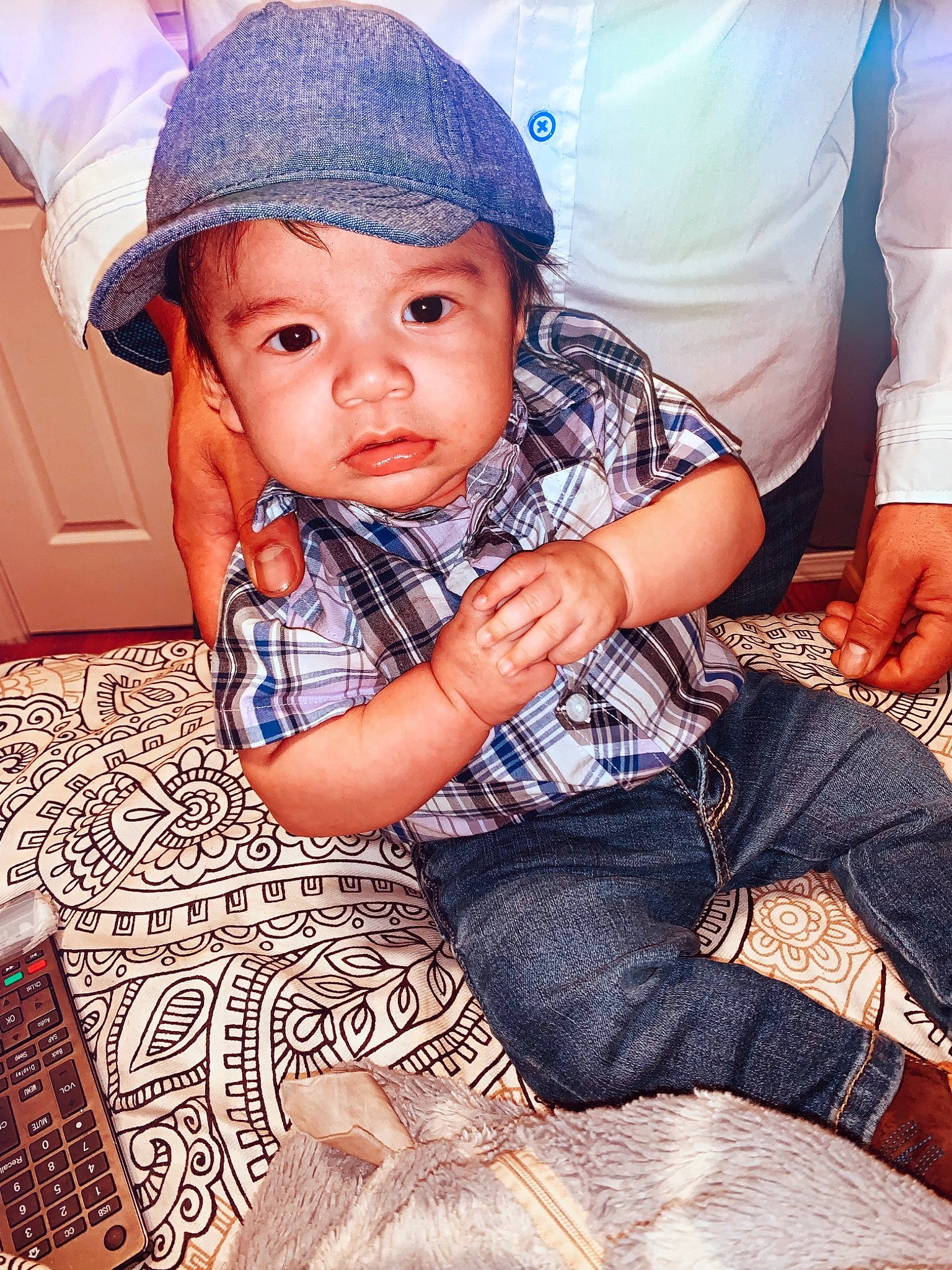 Ernie is registered to the contest to win money with this photo: baby, child, hat, headgear, leg, pattern, people, person, play, sitting, skin, smile, toddler, vacation