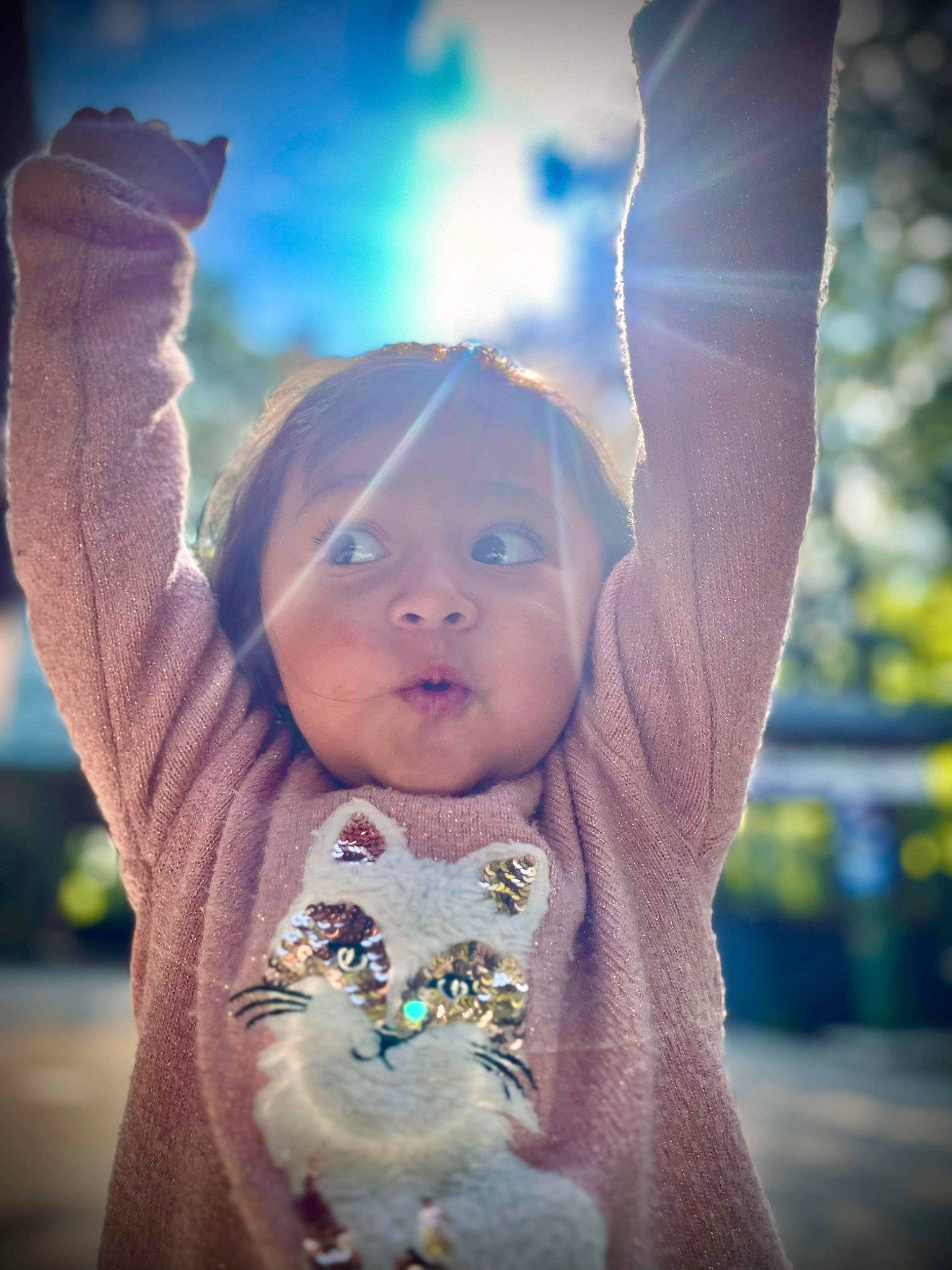 Adele is registered to the contest to win money with this photo: baby, baby_toddler_clothing, child, finger, flash_photography, fun, fur, gesture, grass, happy, head, human_body, people_in_nature, person, play, portrait_photography, skin, sleeve, toddler, tree