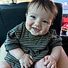 baby, child, smiling, happy, striped_clothing, infant, cute, portrait, sitting, hands, face, person, indoors, car_seat, head, skin, eyebrows, eyelashes, natural_light, young