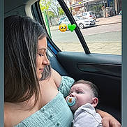 Milan joined the competition — help win amazing prizes! affection, baby, buildings, car_interior, cars, child, daylight, emotion, green_dress, holding, love, pacifier, parenting, person, road, seat, side_profile, street, window, woman