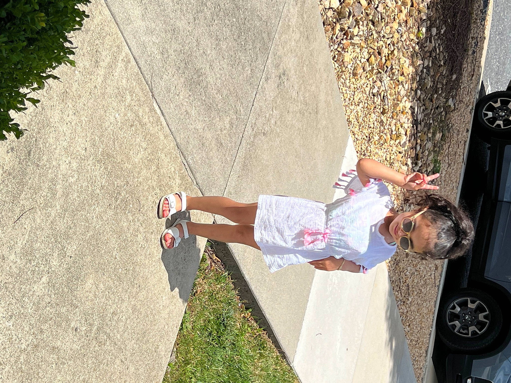 Valerie joined the competition — help win amazing prizes! asphalt, car, concrete, fun, human_leg, leisure, light, line, person, plant, recreation, rolling, shorts, sidewalk, thigh, tire, tree, vehicle, vehicle_door, walking_shoe