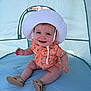 Stetson joined the competition — help win amazing prizes! baby, child, smiling, hat, sunhat, romper, orange_clothing, sandals, tent, blue_tent, sitting, happy, outdoor, cute, infant, sand, summer, playful, portrait, one_person