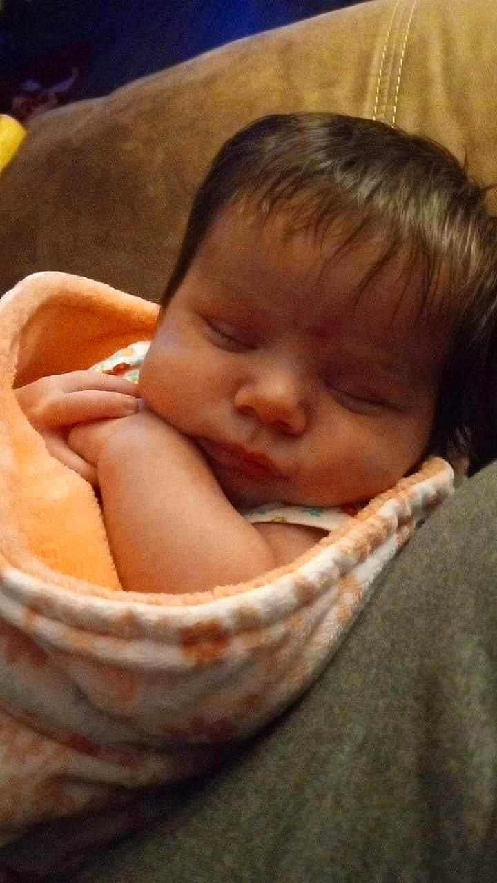 Roselyn is registered to the contest to win money with this photo: baby, baby_products, baby_toddler_clothing, bedtime, cheek, child, close_up, comfort, ear, eyelash, flesh, happy, linens, nap, nose, person, portrait_photography, skin, sleep, toddler