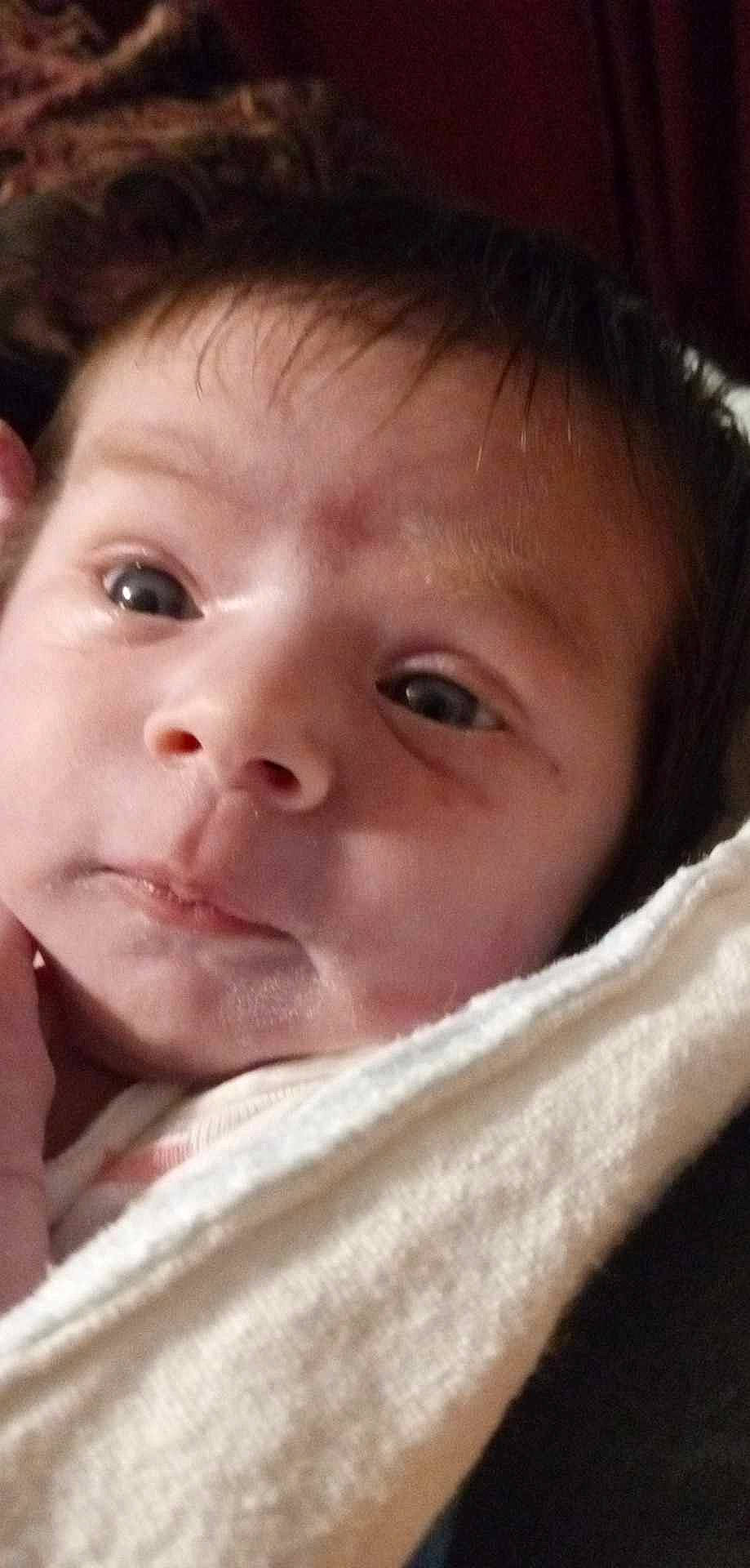 Roselyn is registered to the contest to win money with this photo: baby, cheek, child, chin, comfort, ear, eyebrow, eyelash, forehead, happy, iris, jaw, linens, lip, mouth, no_expression, nose, person, skin, smile