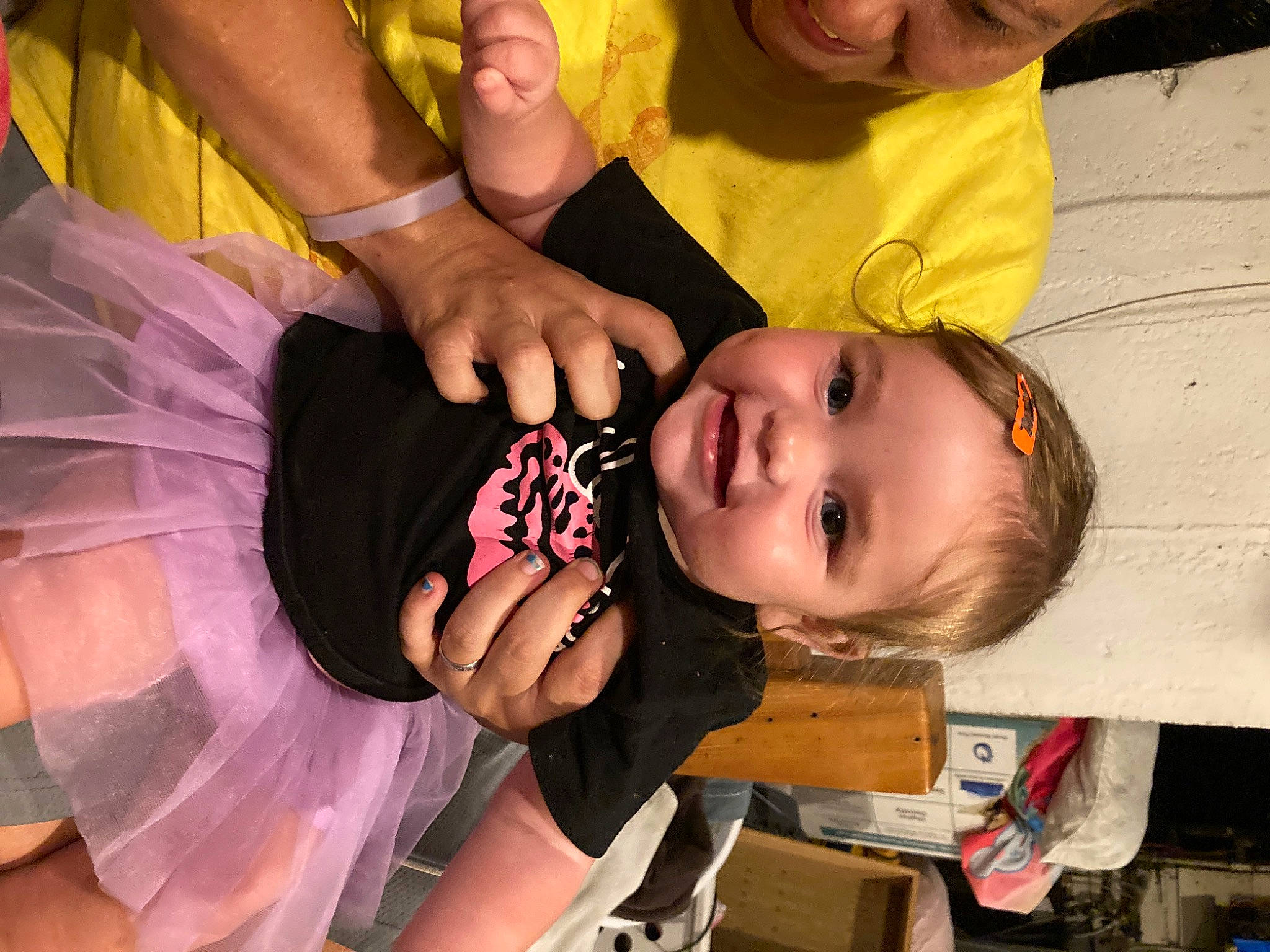 Rriver Rose is registered to the contest to win money with this photo: baby, baby_products, baby_toddler_clothing, child, dress, event, eyelash, finger, fun, gesture, happy, headpiece, iris, joy, magenta, nail, party, person, room, skin
