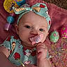 Krimson joined the competition — help win amazing prizes! baby, blanket, blue, carpet, celebration, closeup, colorful, cute, easter_eggs, face, green, hand, headband, indoors, infant, marshmallow, patterned_clothing, peeps, pink, toy