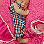 baby, sleeping, blanket, pink, clothing, infant, pattern, elephant_pattern, romper, foot, hand, face, cozy, cute, indoor, soft_texture, peaceful, child, newborn, resting