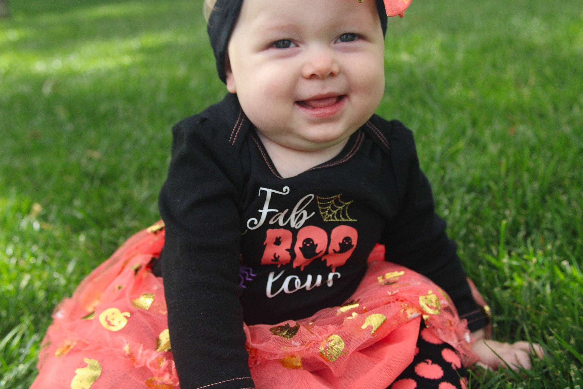 Clarice is registered to the contest to win money with this photo: baby, baby_toddler_clothing, child, cool, fun, grass, happy, head, headwear, iris, joy, leaf, lip, pattern, people_in_nature, person, pink, plant, skin, sleeve