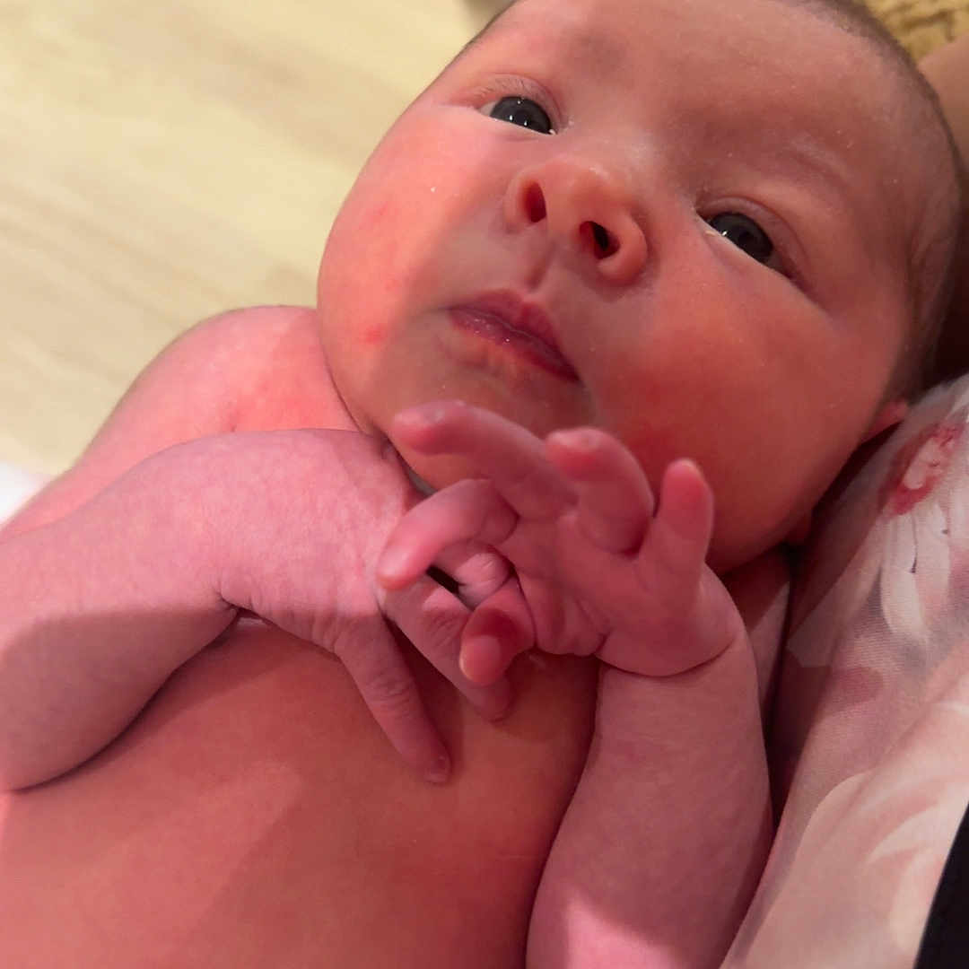 Maeve joined the competition — help win amazing prizes! baby, closeup, couch, cute, diaper, eyes, face, hand, human, indoor, infant, newborn, newborn_baby, person, pillow, resting, skin, soft, tiny_fingers, umbilical_cord