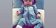 Ezra joined the competition — help win amazing prizes! baby, casual, clothing, comfortable, couch, cute, face, fashion, headwear, hoodie, indoor, infant, nike, person, pillow, portrait, shoes, sitting, sneakers, sock
