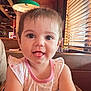 Amelia joined the competition — help win amazing prizes! child, toddler, smiling, tongue_out, cute, indoor, restaurant, wood, blinds, light, face, person, clothing, sleeveless, pink, seat, table, happy, young, portrait