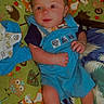 Brayden is registered to the contest to win money with this photo: baby, bed, bedroom, blanket, clothing, couch, cushion, face, furniture, head, homedecor, indoors, pants, person, photography, portrait, quilt, room, shorts, t_shirt