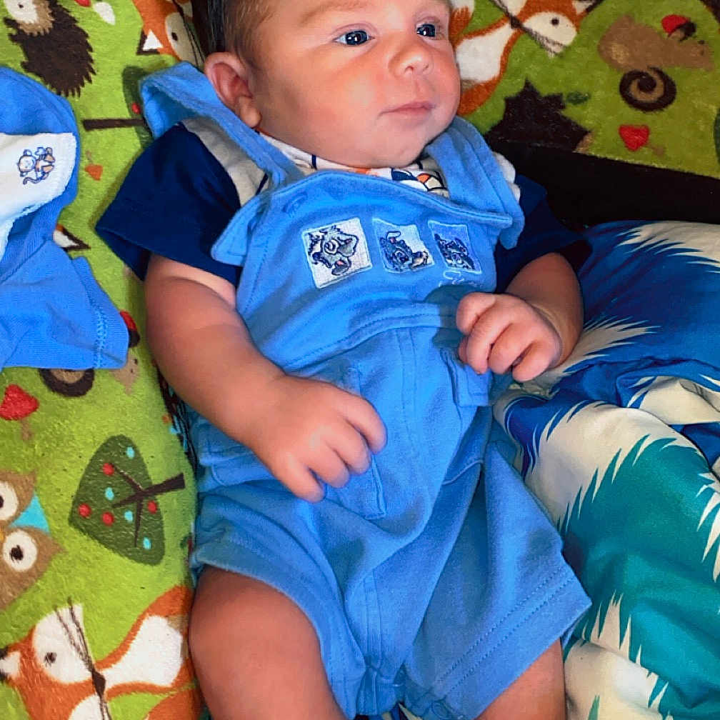 Brayden joined the competition — help win amazing prizes! baby, bed, bedroom, blanket, clothing, couch, cushion, face, furniture, head, homedecor, newborn, pants, person, photography, portrait, quilt, shorts, sleeping, t_shirt