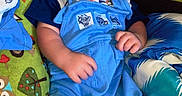 Brayden is registered to the contest to win money with this photo: baby, bed, bedroom, blanket, clothing, couch, cushion, face, furniture, head, homedecor, newborn, pants, person, photography, portrait, quilt, shorts, sleeping, t_shirt