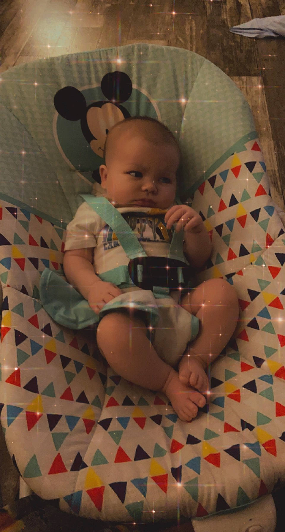 Easton is registered to the contest to win money with this photo: baby, baby_products, baby_toddler_clothing, cheek, child, comfort, facial_expression, finger, head, human, human_body, mammal, mouth, pattern, person, pink, sitting, skin, textile, thigh