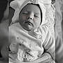baby, sleeping, headwrap, bow, clothing, infant, cute, cozy, portrait, monochrome, black_and_white, soft, peaceful, closeup, face, newborn, resting, baby_outfit, indoors, blanket