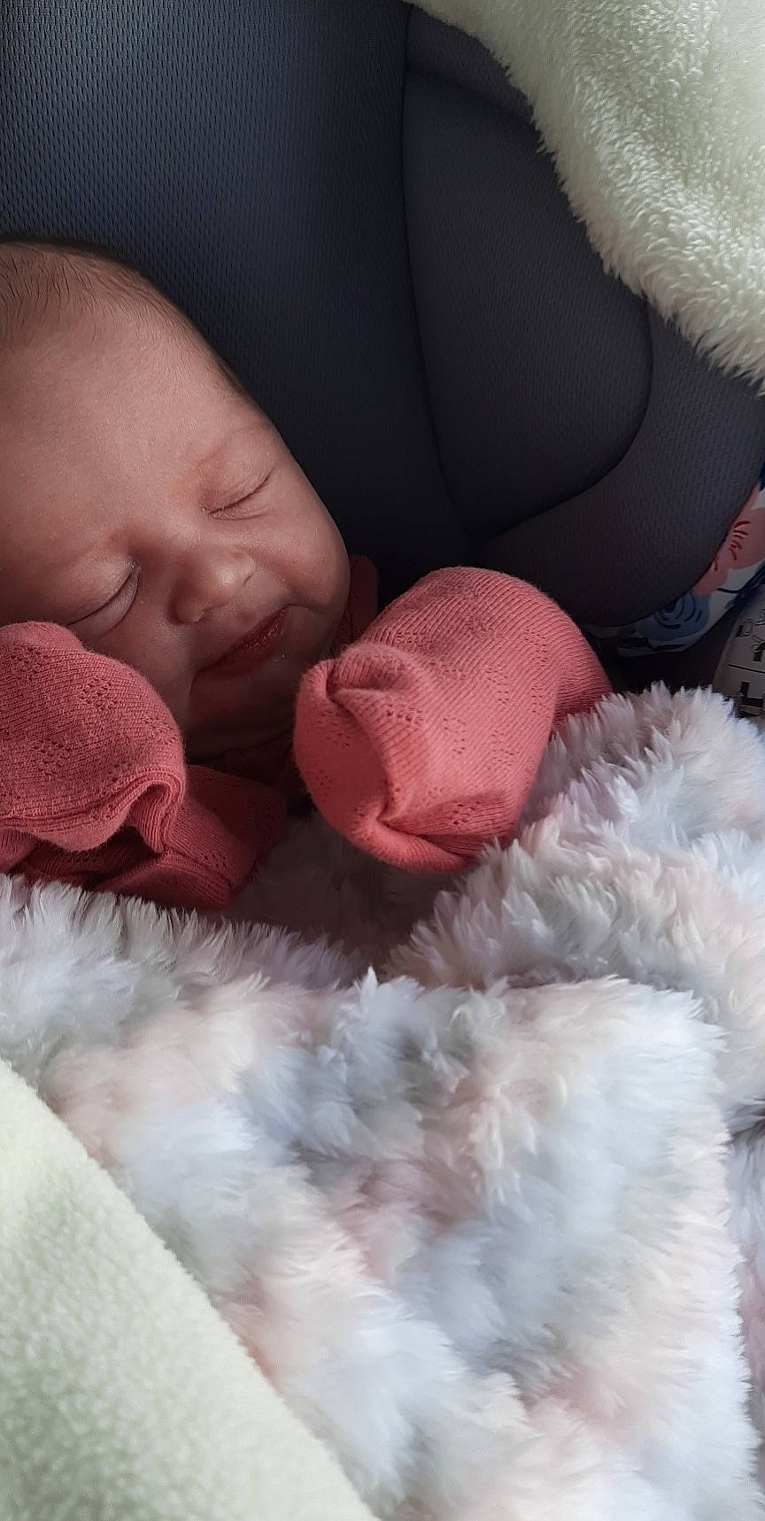 Skylar is registered to the contest to win money with this photo: baby, cheek, child, comfort, eye, gesture, happy, linens, lip, mammal, mouth, natural_material, nose, person, pink, red, skin, textile, toddler, vertebrate