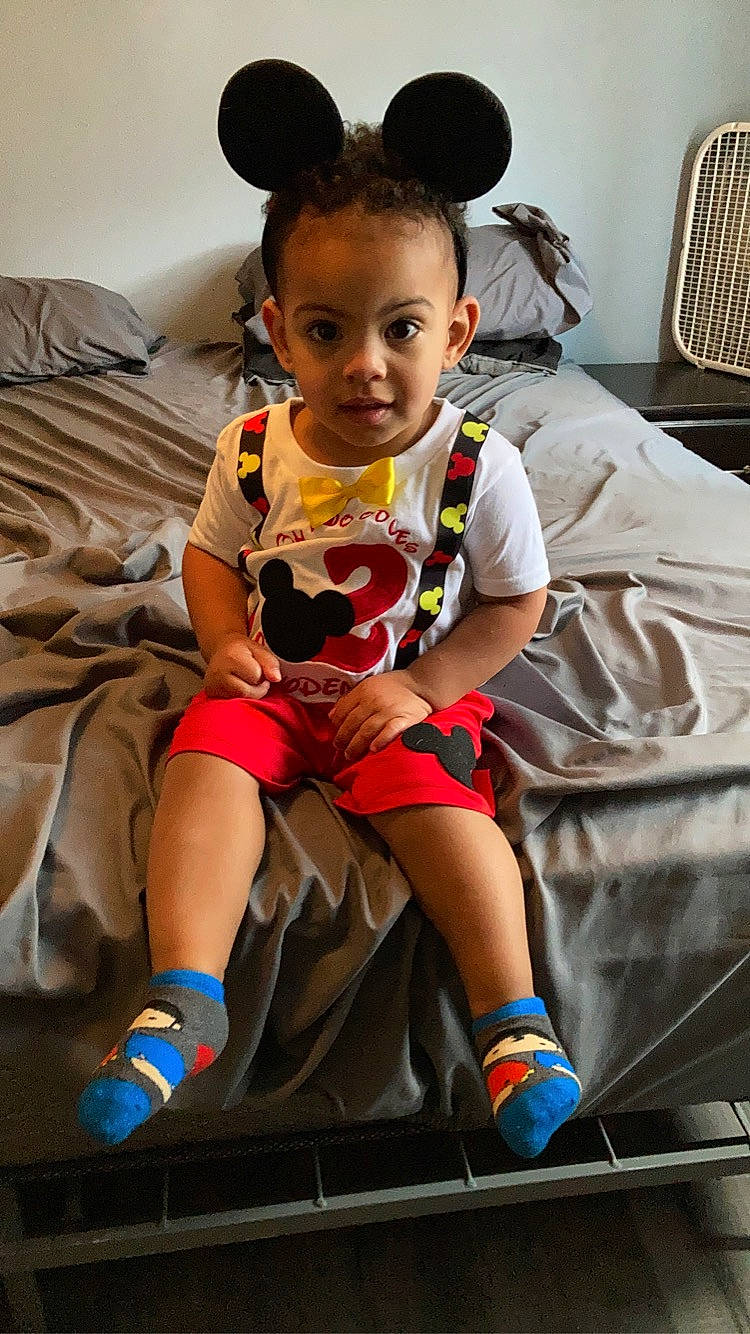 Jayden is registered to the contest to win money with this photo: arm, baby, baby_toddler_clothing, black, cheek, child, chin, dress, eye, fun, happy, human_leg, people, person, pink, shorts, skin, sneakers, t_shirt, toddler