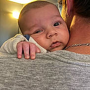 Blayze is registered to the contest to win money with this photo: baby, child, person, hand, face, shoulder, adult, indoor, light, skin, clothing, necklace, hair, expression, comfort, grip, closeup, portrait, cozy, resting