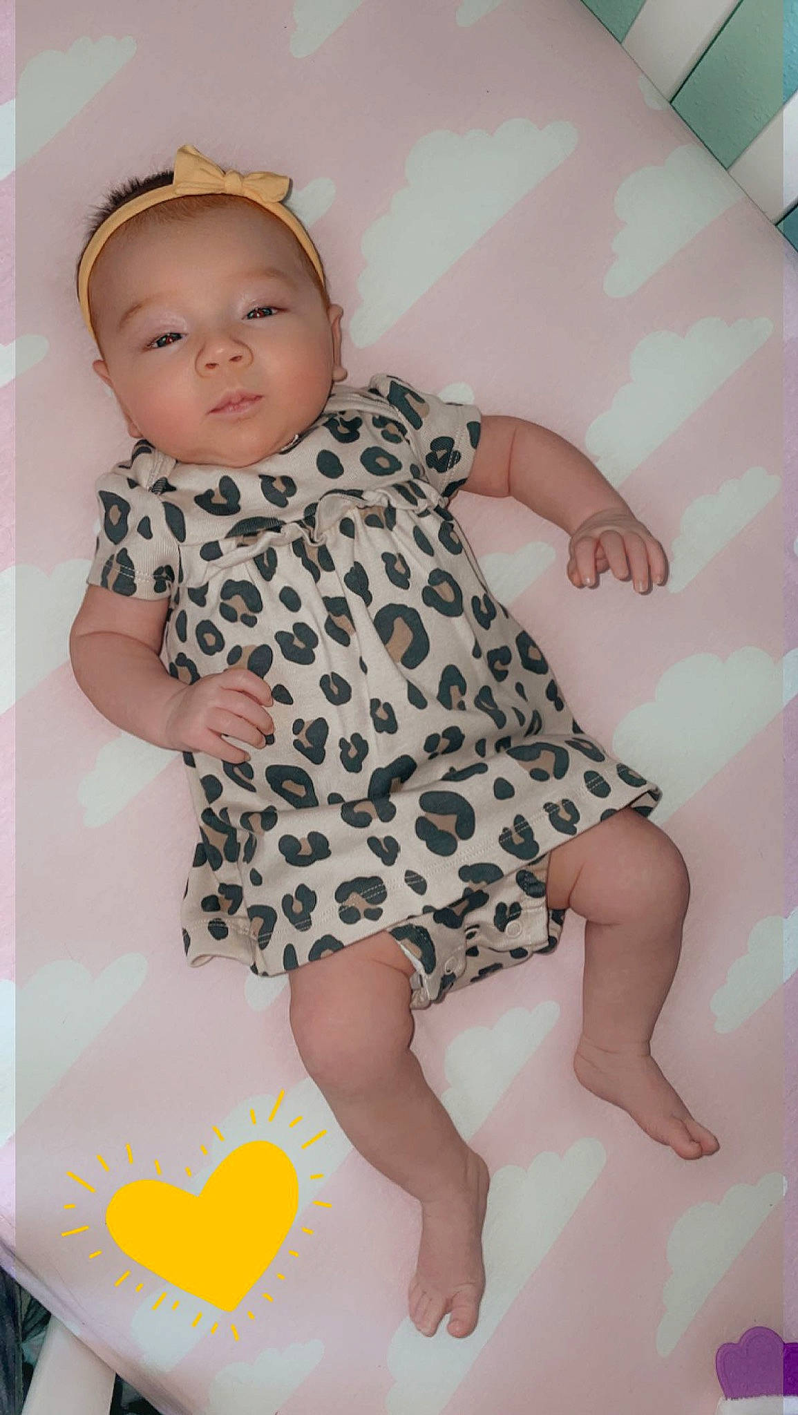 Delilah is registered to the contest to win money with this photo: arm, baby, baby_toddler_clothing, day_dress, dress, finger, hand, happy, joint, one_piece_garment, person, pink, shoulder, skin, sleeve, smile, textile, thigh, toddler, white