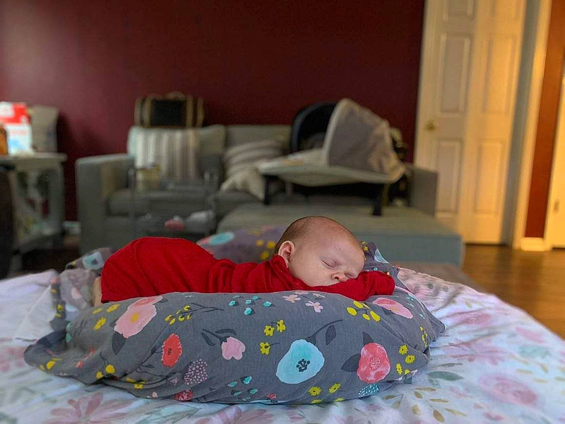 Alana is registered to the contest to win money with this photo: baby, baby_products, baby_toddler_clothing, bed, bed_sheet, bedding, bedroom, bedtime, child, comfort, door, face, flooring, hardwood, linens, mattress, nap, person, room, toddler