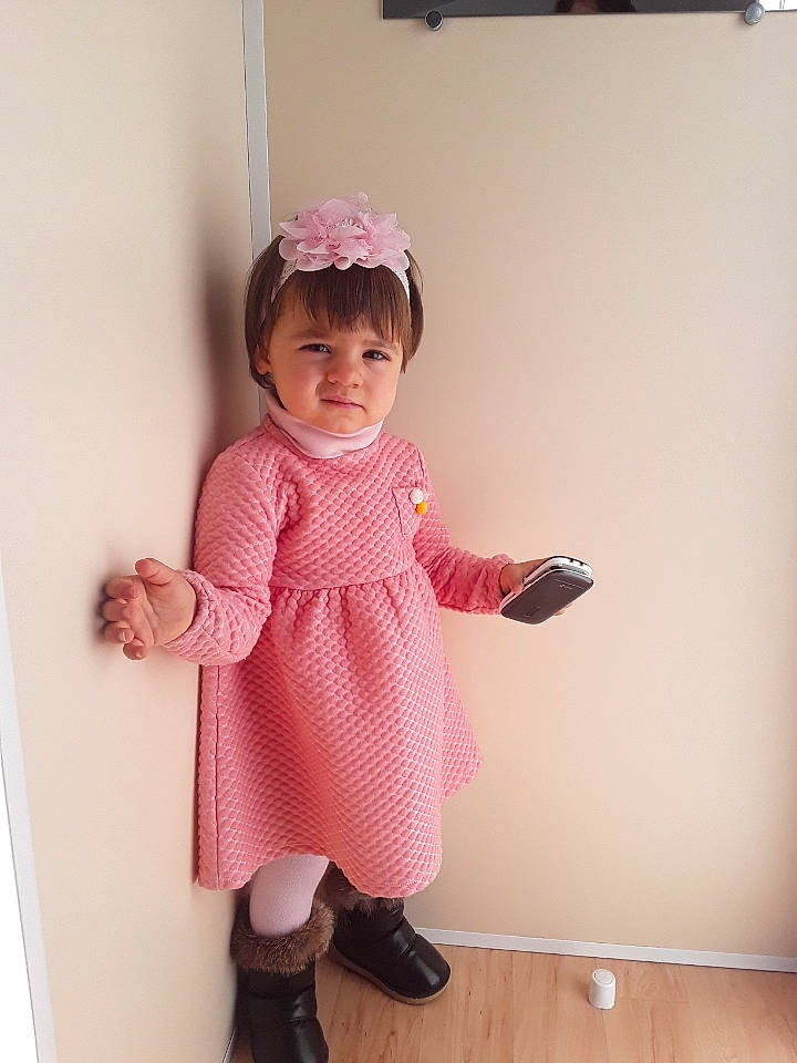 Sarah participe au concours pour gagner de l'argent avec cette photo : baby, baby_toddler_clothing, boot, child, day_dress, dress, fashion_accessory, human_body, human_leg, knee, magenta, one_piece_garment, pattern, person, pink, sandal, sleeve, sock, thumb, toddler
